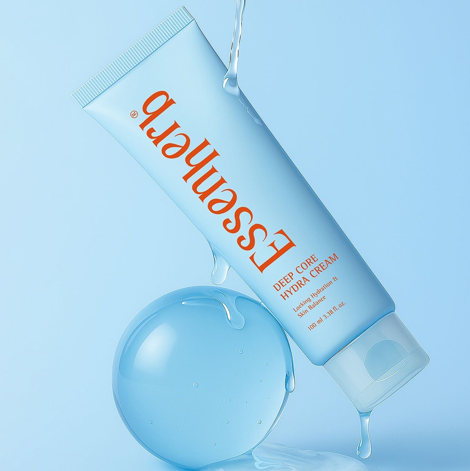 Crème ESSENHERB Deep Core Hydra Cream 100ml avec hydratation intense, tube sur fond bleu avec bulle d'eau.
