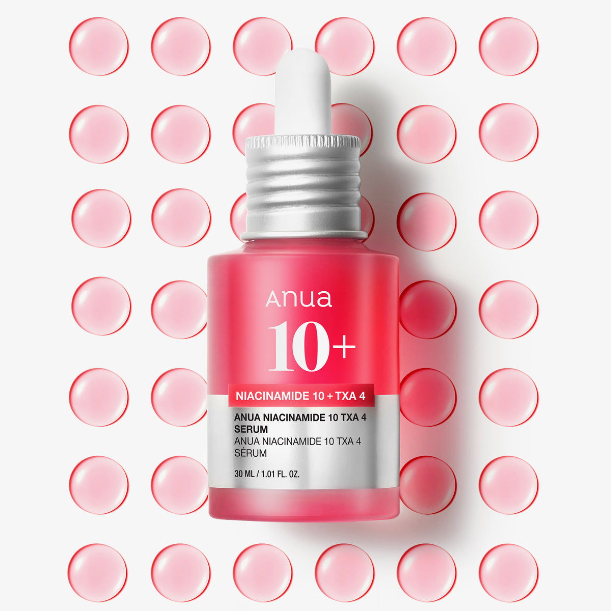 ANUA Niacinamide 10% +TXA 4% Dark Spot Correcting Serum 30ml d’Anua, sérum en bouteille rouge sur fond de gouttes.