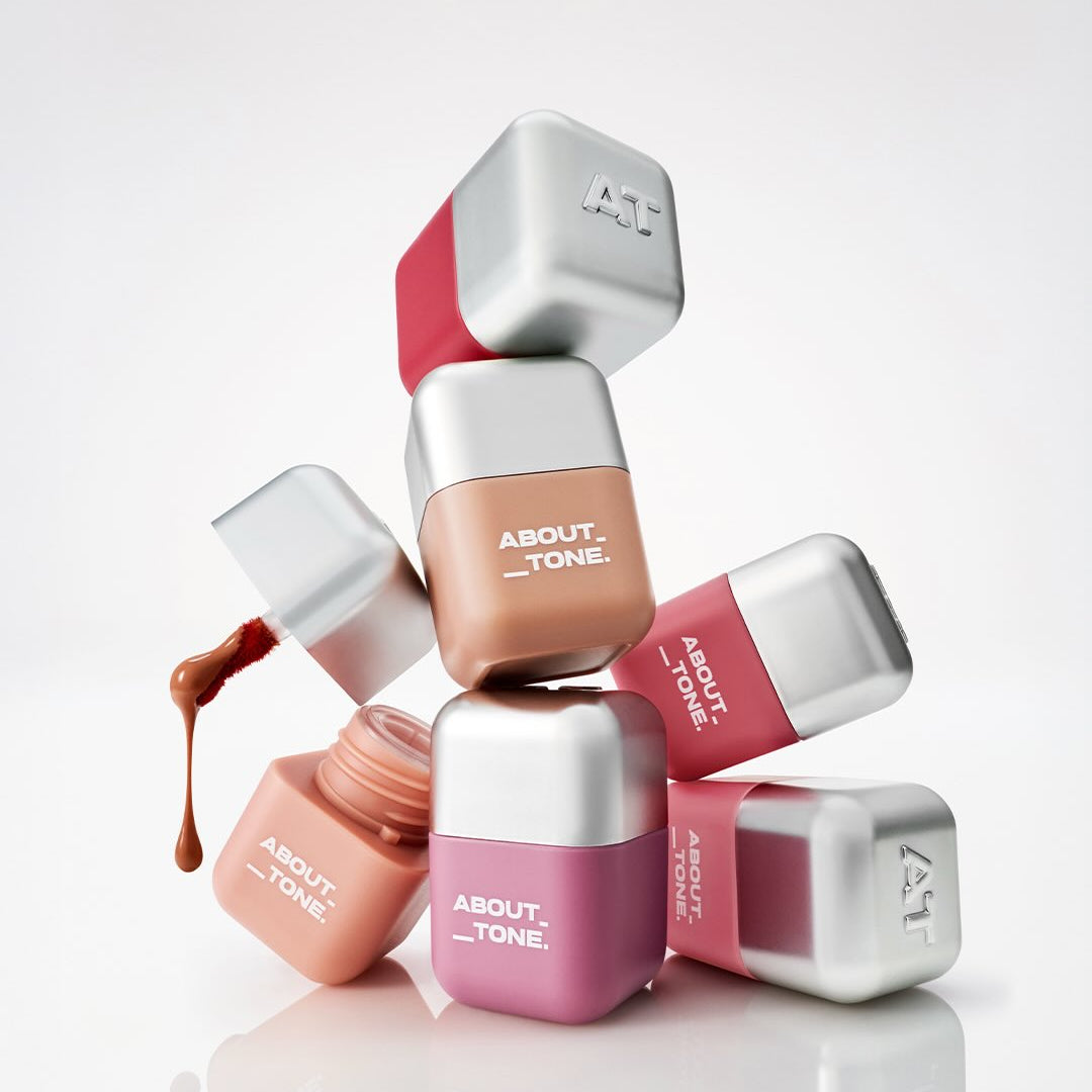 ABOUT TONE Blur Fit Tint Mini 2.3g, pack de tints ABOUT TONE sur fond clair, teintes pêche et brun.