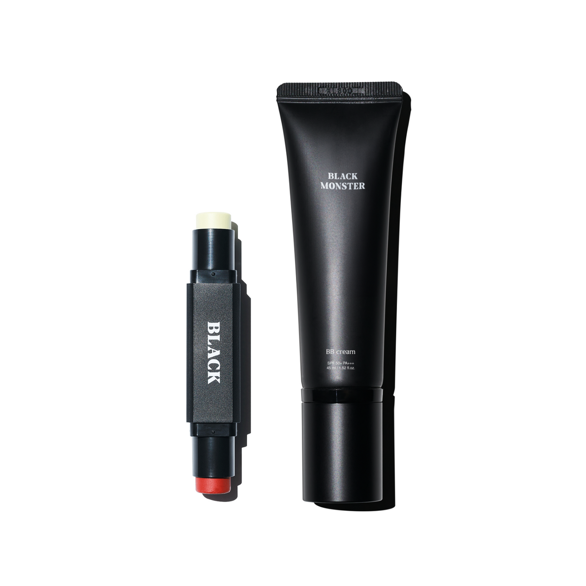 BLACK MONSTER Basic Set de marque Black Monster : tube noir et stick, fond blanc, produit de soin visage.