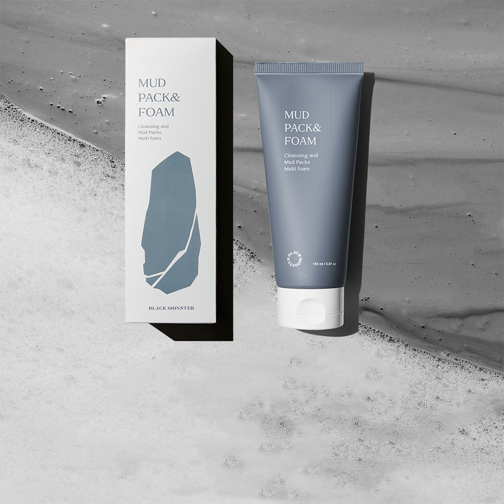 BLACK MONSTER Mud Pack & Foam 150ml, pack et tube sur fond béton gris, contexte visuel produit marque noire.
