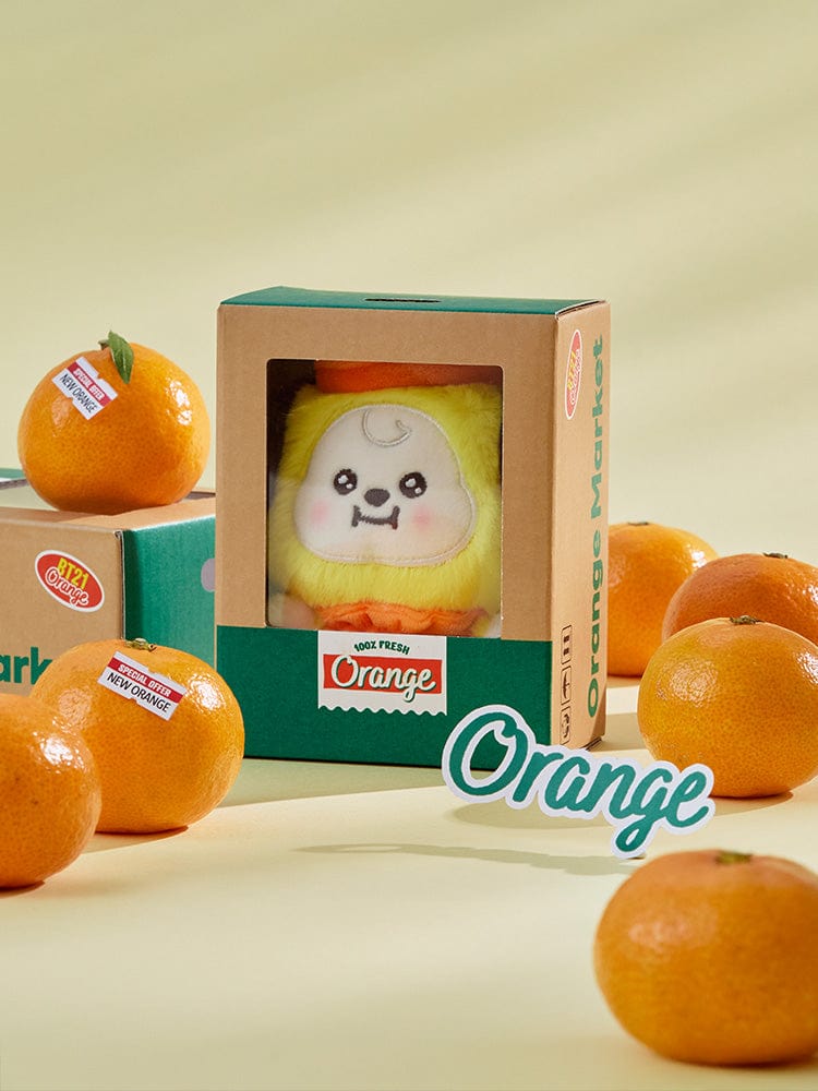 BT21 CHIMMY BABY PLUSH ORANGE PARTY : peluche orange CHIMMY Jimin BTS officielle, emballage vert et oranges sur fond beige
