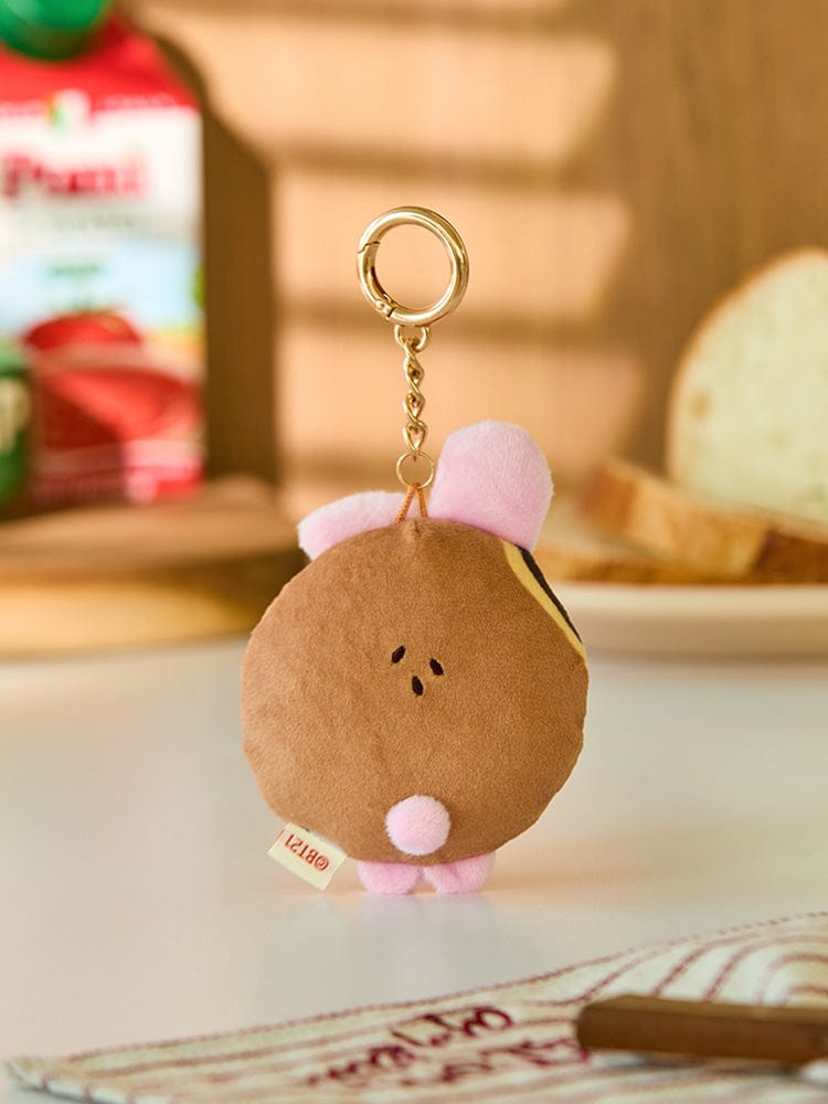 BT21 COOKY BABY PLUSH KEYRING BAKERY SHOP : porte-clés peluche COOKY bébé dans un décor pâtisserie, officiel LINE FRIENDS.