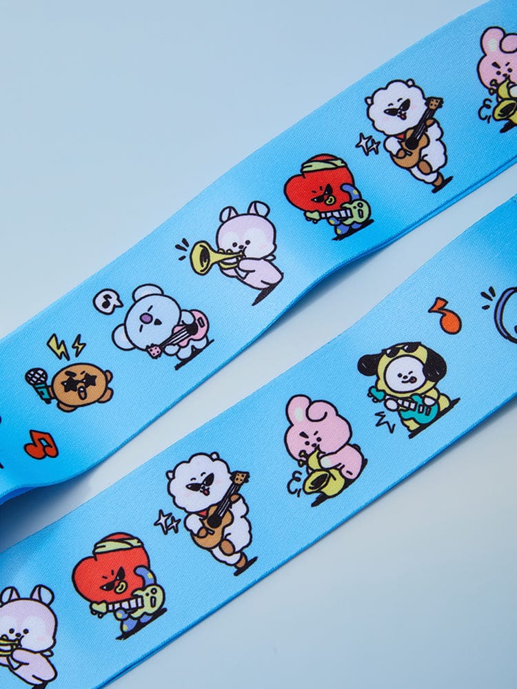 BT21 LUGGAGE BELT WORLD VOYAGE : sangle de valise bleue LINE FRIENDS avec personnages BT21, motif illustré pour voyages.
