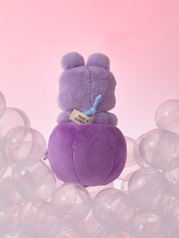 BT21 MANG minini PLUSH LUCKY GATCHA : peluche MANG j-hope BTS, posée sur bulles transparentes, fond rose pastel.