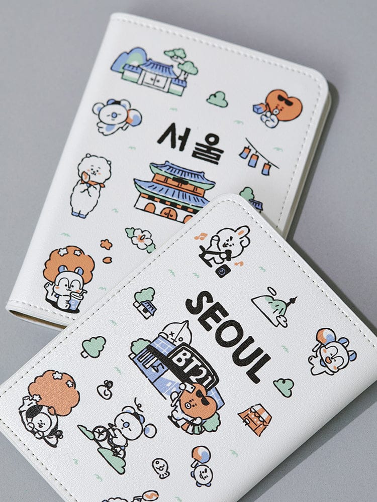 BT21 PASSPORT COVER SEOUL EDITION LINE FRIENDS, pochette passeport blanche avec personnages BT21 et skyline de Séoul