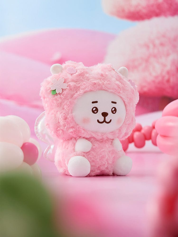 BT21 RJ BABY SITTING PLUSH SPRING FAIRY, peluche officielle LINE FRIENDS : alpaga rose assis, décor printanier, fond pastel.