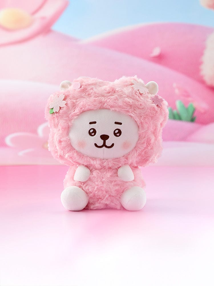 BT21 RJ BABY SITTING PLUSH SPRING FAIRY, peluche officielle LINE FRIENDS alpaga RJ rose assis, fond printanier