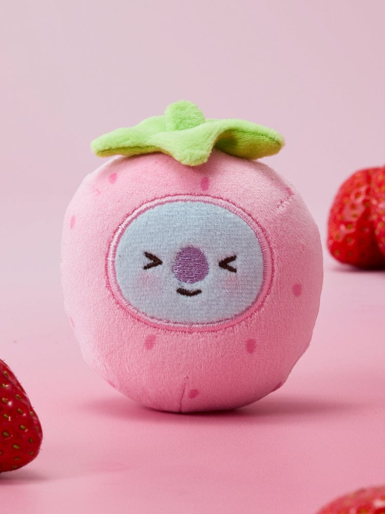 BT21 STRESS BALL STRAWBERRY PARTY : boule anti-stress fraise rose mignonne sur fond rose avec fraises, marque BT21