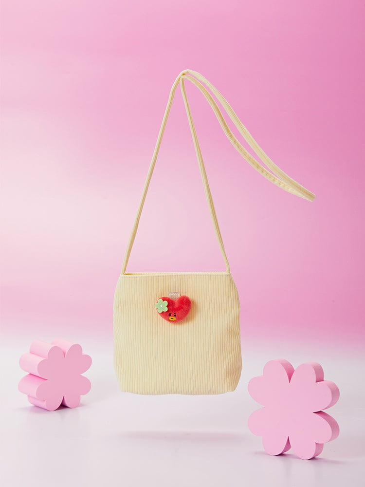 BT21 TATA MINI CORDUROY CROSSBODY BAG SPRING DAYS LINE FRIENDS : mini sac bandoulière corduroy jaune sur fond rose.