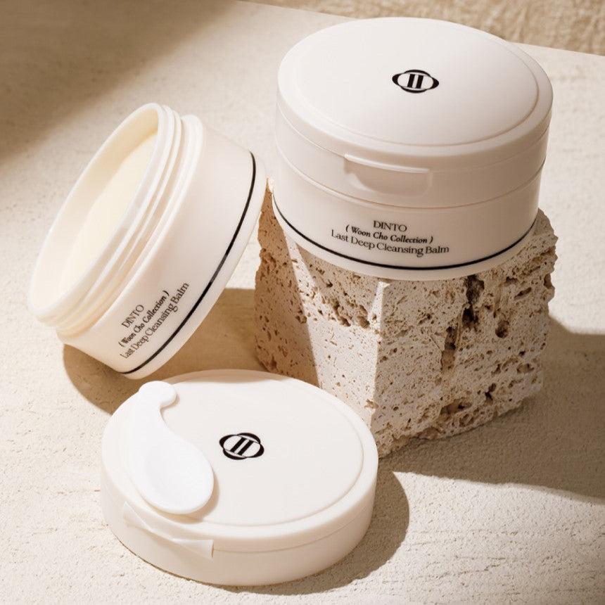 DINTO Last Deep Cleansing Balm 100ml de la marque DINTO, pot cosmétique sur fond beige, texture crème visible.