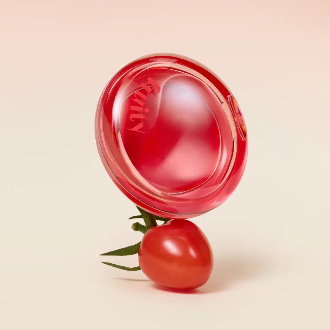 ETUDE Fruity Lip & Cheek Blur Balm 2.3g de la marque ETUDE, baume rouge sur fond beige avec fruits visuels
