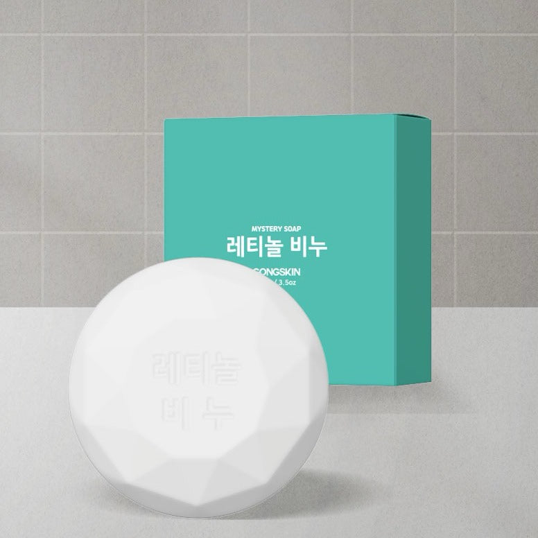 Savon GONGSKIN Retinol Soap 100g avec boîte turquoise en arrière-plan, idéal pour soins de la peau.