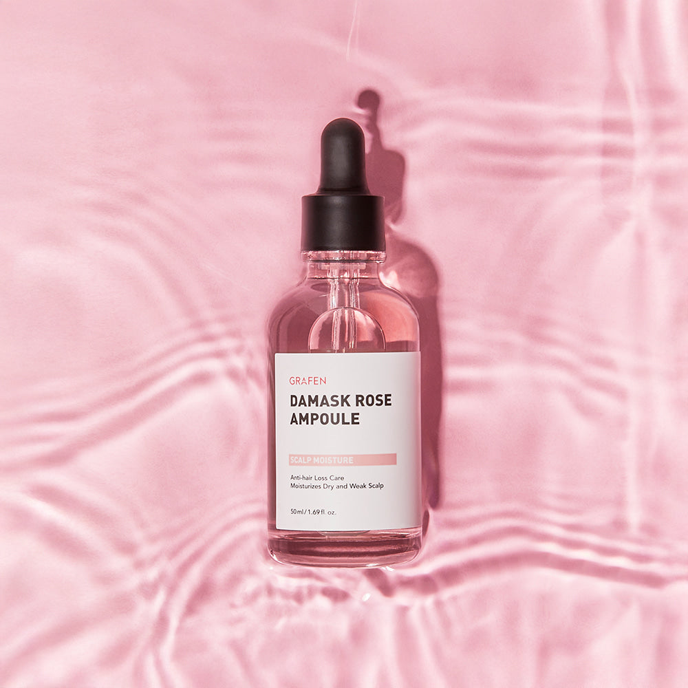 GRAFEN Damask Rose Ampoule 50ml : flacon sérum rosé sur tissu rose, fond damassé, marque GRAFEN