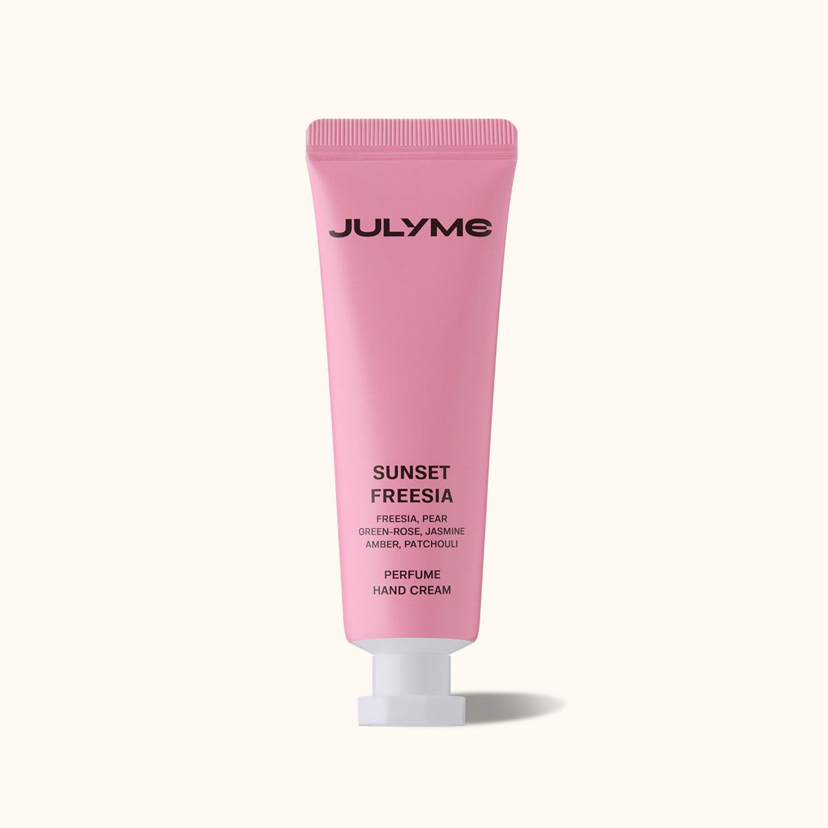 Tube de JULYME Perfume Shea Butter Hand Cream 30ml, crème pour mains parfumée au beurre de karité, fond rose élégant.