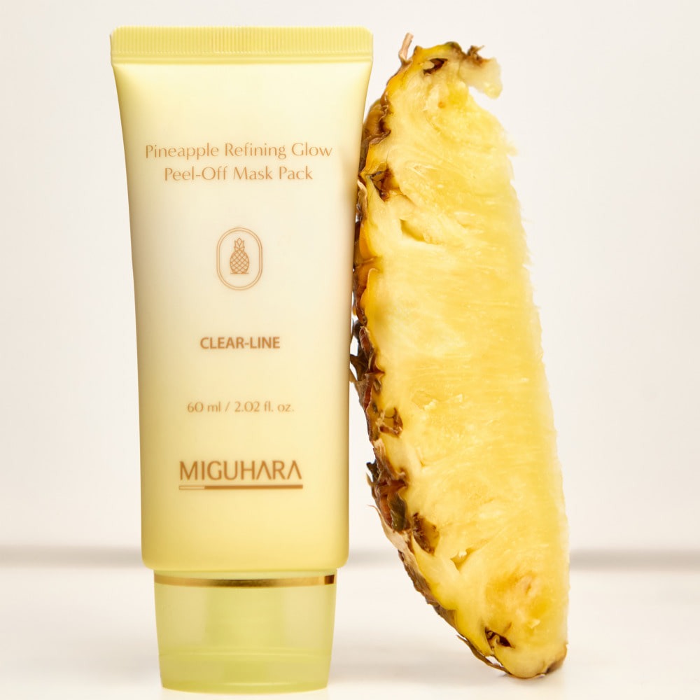 MIGUHARA Pineapple Refining Glow Peel Off Mask Pack 60ml, masque à la marque MIGUHARA sur fond clair, avec tranche d’ananas