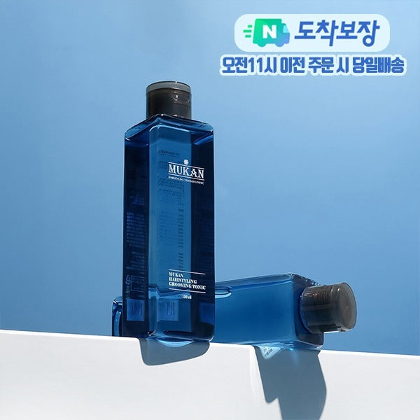 MUKAN Root Booster Ampoule 50ml : flacon bleu sur fond bleu, marque MUKAN visible, produit en contexte visuel