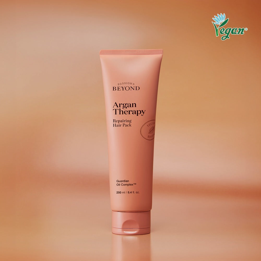 PASSION & BEYOND Argan Therapy Repairing Hair Pack 250ml, tube de soin cheveux sur fond orange, produit de la marque.
