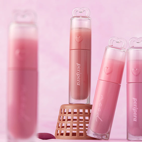 PERIPERA Ink Mood Glowy Tint de la marque PERIPERA, baumes teints rosés sur fond rose, flacons mignons cœur.