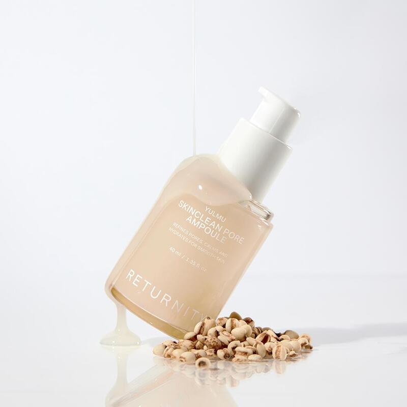 RETURNITY Yumu Pore Ampoule 40ml de la marque RETURNITY, sur fond blanc avec flacon et gouttes d’amandes.