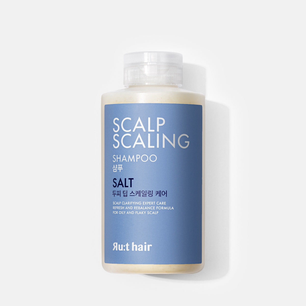RU:T HAIR Scalp Scaling Salt Shampoo 300ml, flacon bleu et blanc sur fond clair, marque RU:thair, photo produit