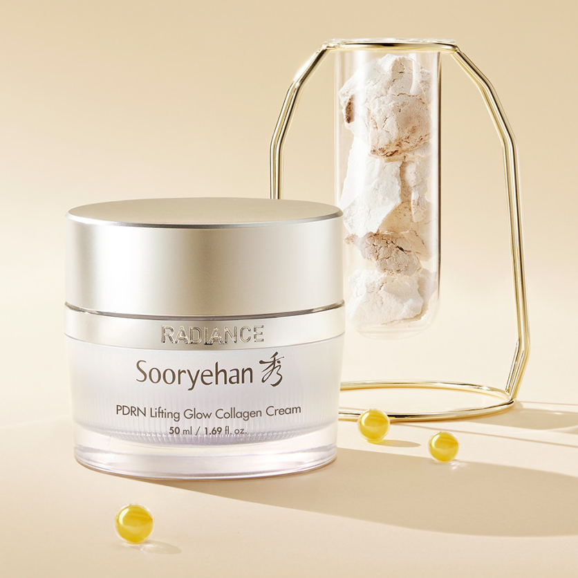 Crème SOORYEHAN Radiance PDRN lasticity 50ml exposée avec perles dorées et un récipient élégant.
