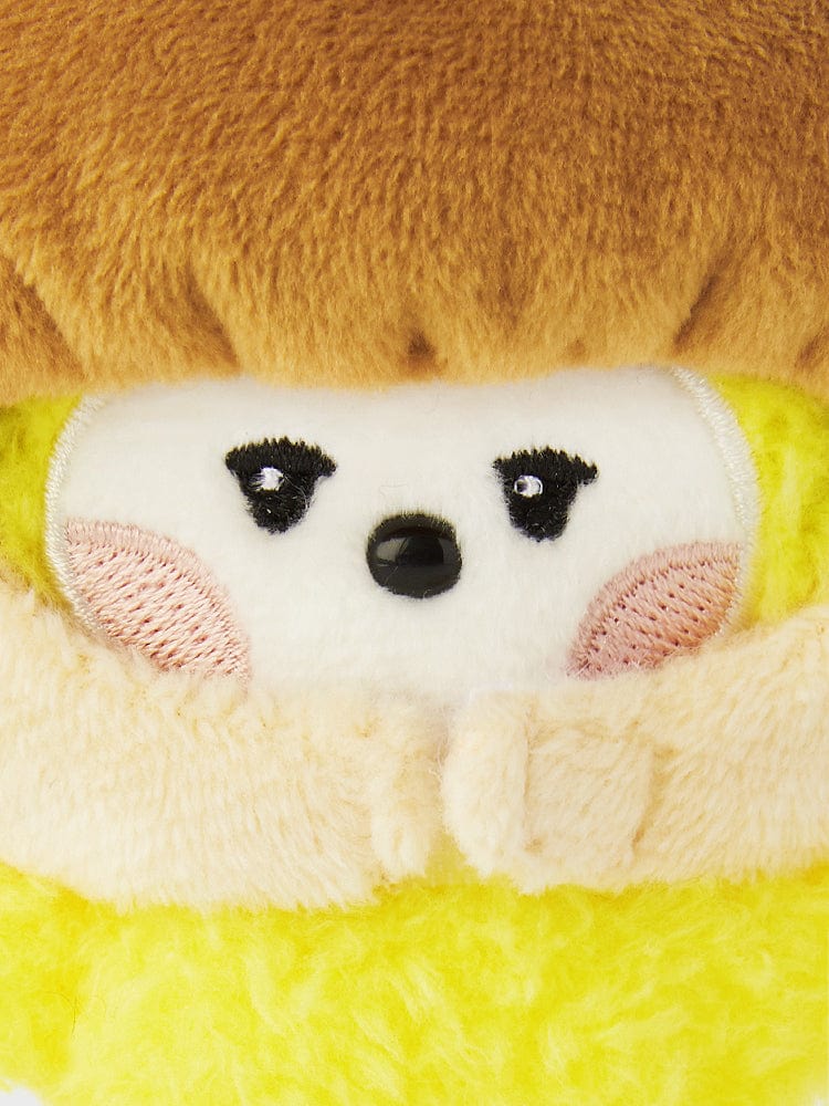 BT21 CHIMMY mini minini VEGGIE DOLL de marque BT21, peluche aux formes arrondies, visage de chiot sur fond jaune vert.