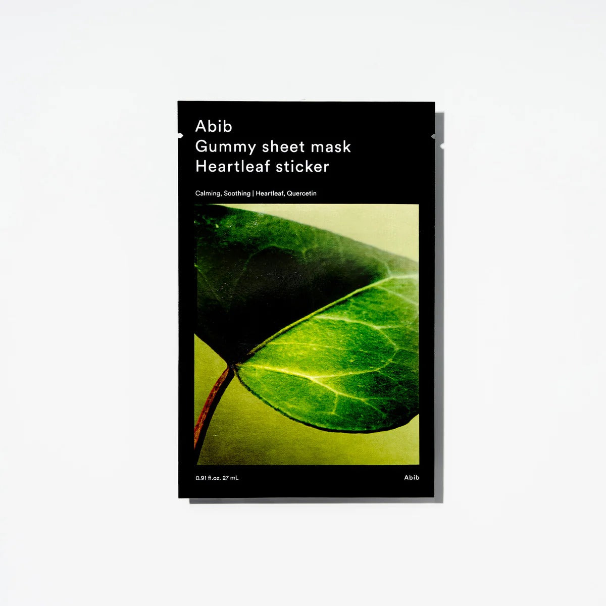 ABIB Gummy Sheet Mask Heartleaf Sticker, masque en feuille avec cœur d’herbe, pack noir sur fond blanc.