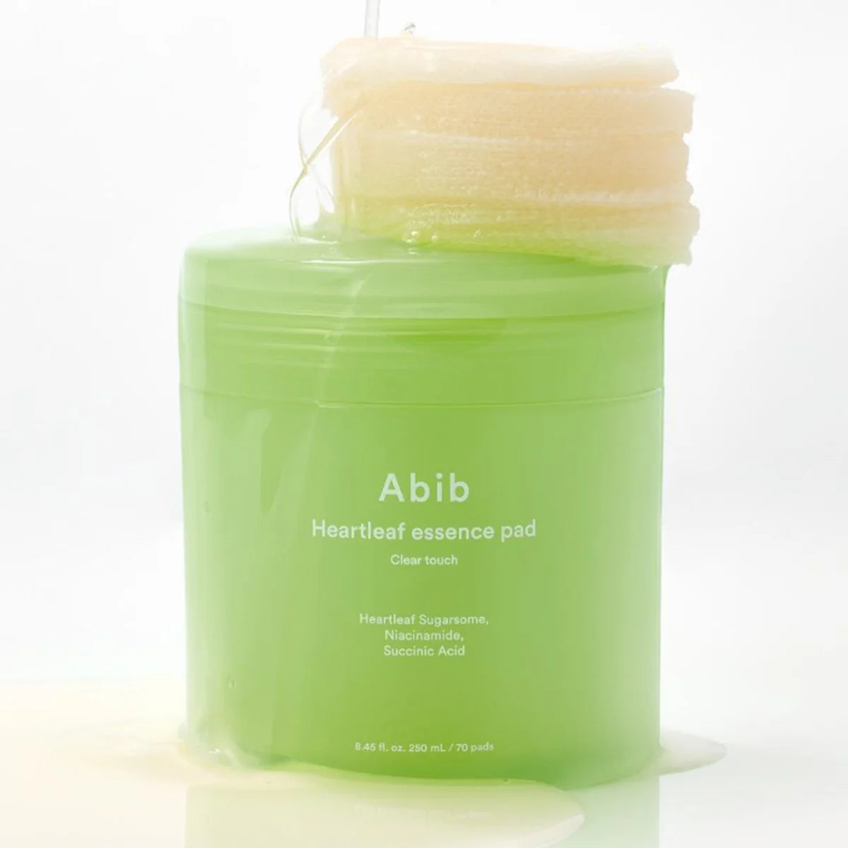 ABIB Heartleaf Spot Pad Calming Touch 70 pads, produit ABIB en pad vert sur fond clair, contexte visuel.