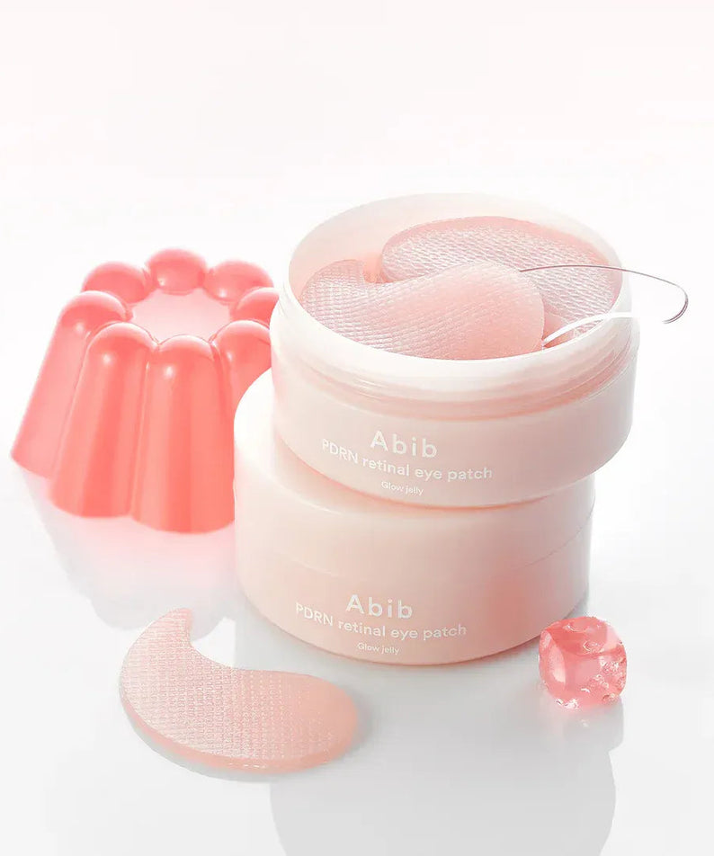 Décris l'image en français : ABIB PDRN Retinol Eye Patch Glow Jelly 30 Pairs, patchs de la marque ABIB sur fond clair.