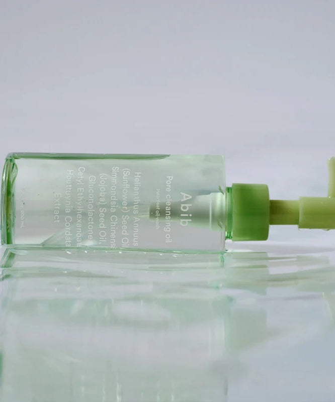 ABIB Pore Cleansing Oil Heartleaf Oil-Wash 200ml, flacon vert sur fond clair, contexte visuel skincare anti-pores