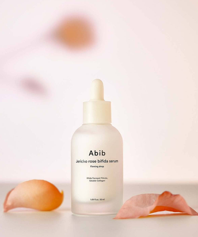 ABIB  Resurrection Bifida Serum Firming Drops 50ml, flacon sérum ABIB sur fond pastel, gouttes et textures biorévélation