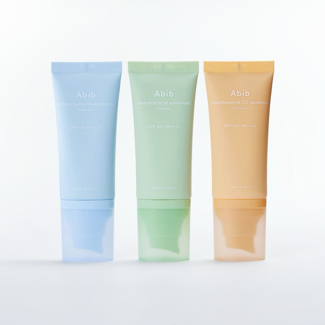 ABIB Sunscreen Tube 50ml 3 Types, trois tubes Abib sur fond clair : bleu, vert et beige, produits solaires.