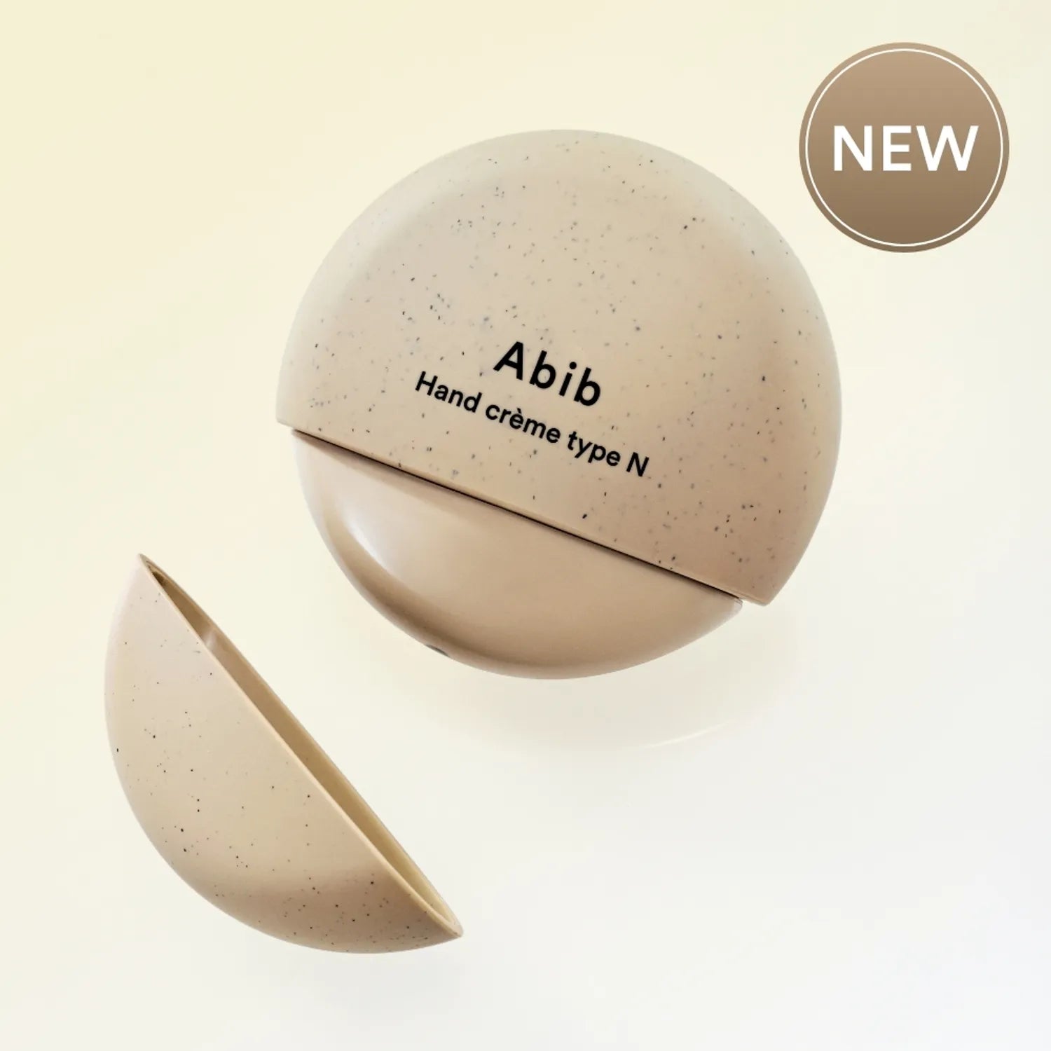 ABIB  Hand Cream Type N 50ml : crème pour les mains Abib, pack en forme de galet sur fond clair NEW