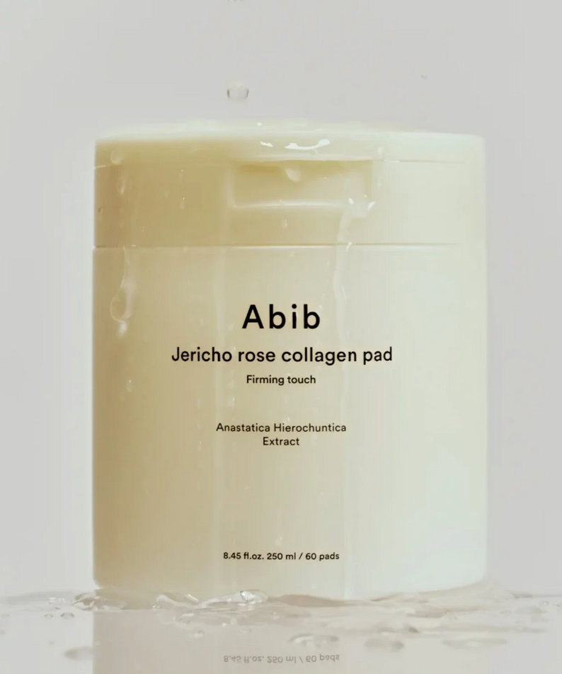ABIB Jericho Rose Collagen Pad Firming Touch 60 Pads sur un fond blanc, montrant les détails du packaging et l'extrait d'Anastatica Hierochuntica.