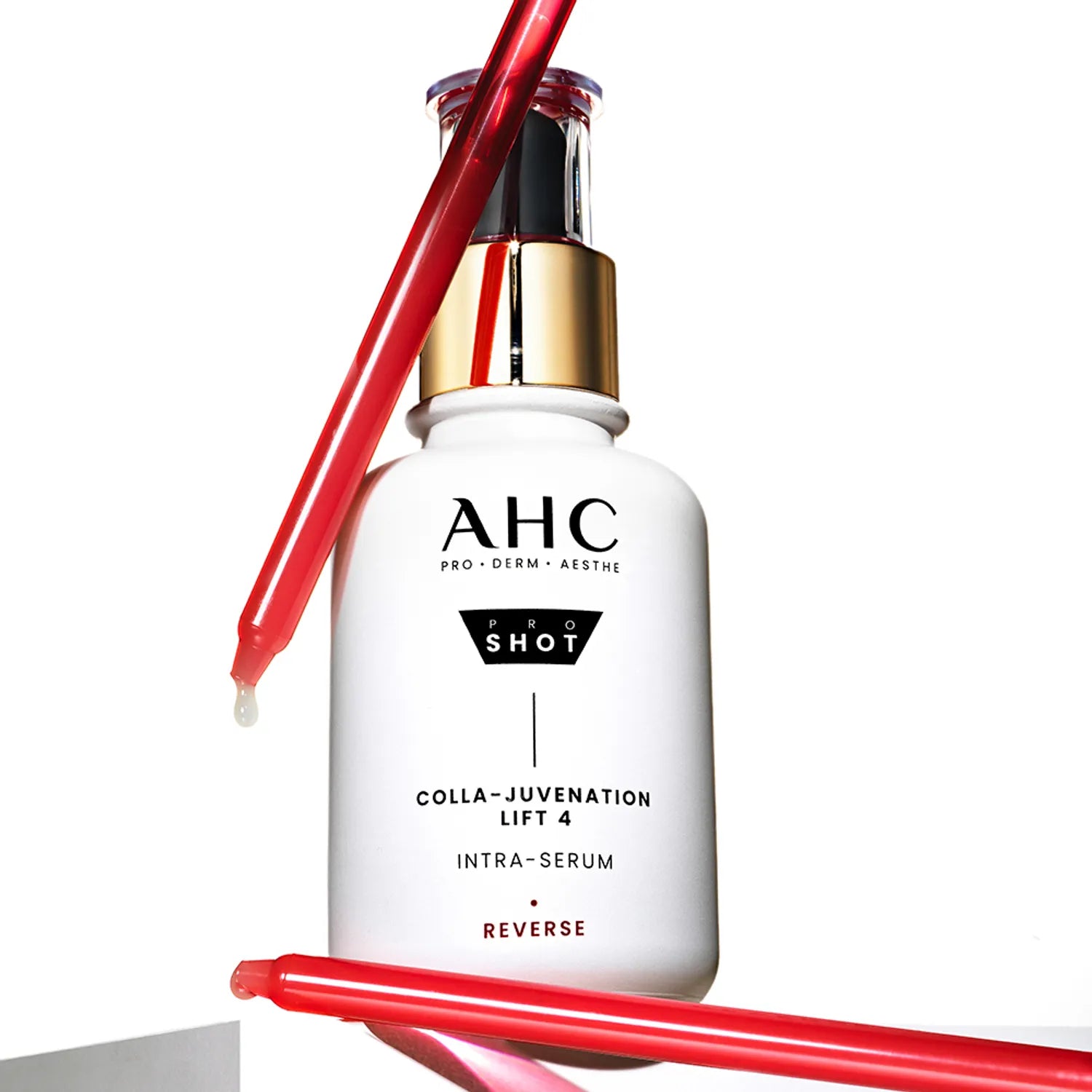 AHC Pro Shot Cola Juvenation Lift 4 Intra Serum 40ml AHC, flacon blanc avec gouttes rouges sur fond blanc.