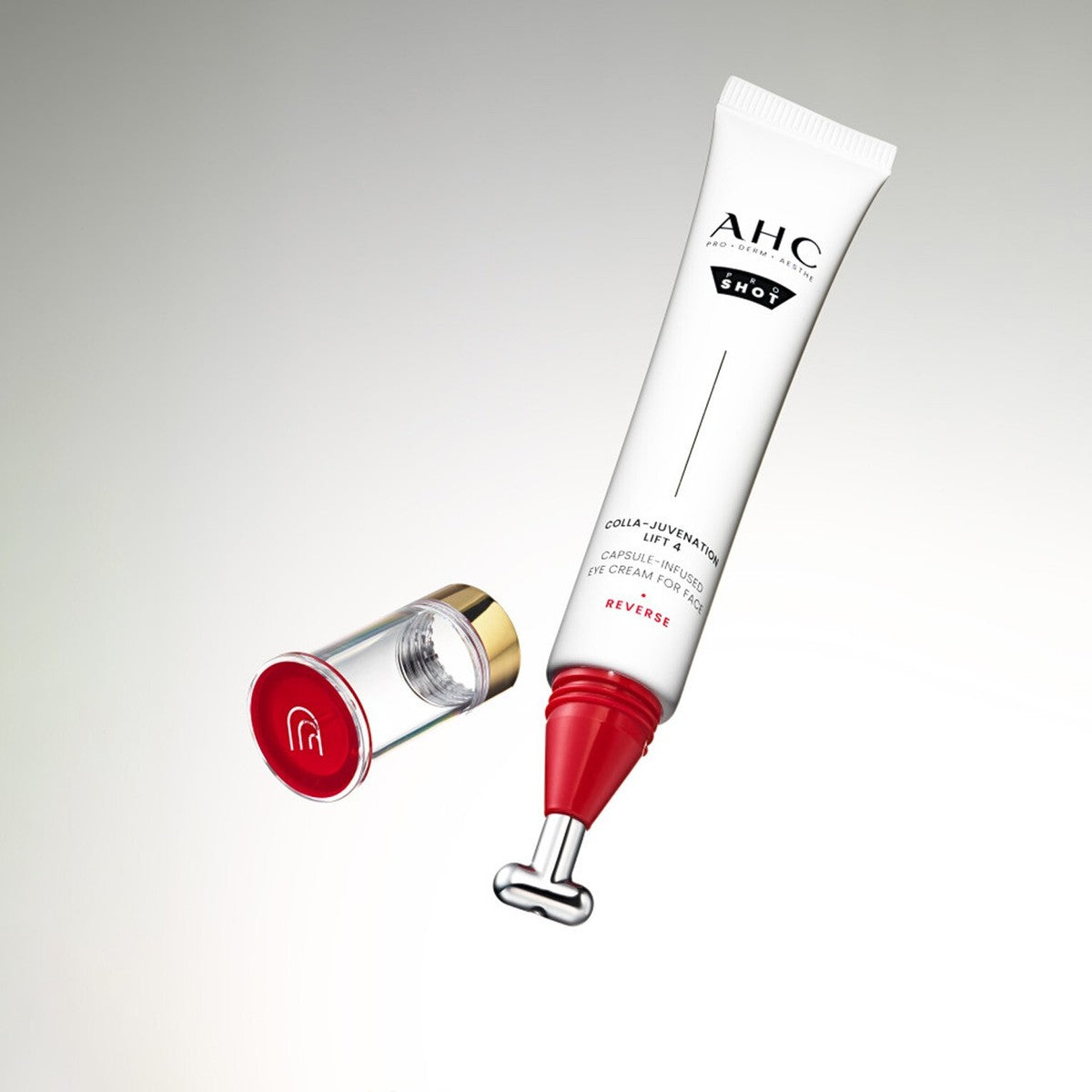 Décris l'image en français : AHC Proshot Collagen Juvenion Lift 4 Capsule Infused Eye Cream for Face 30ml, tube AHC sur fond clair.
