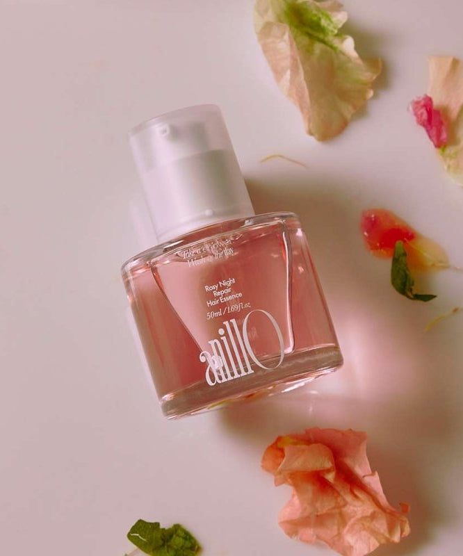 ANILLO Rosy Night Repair Hair Essence 50ml : flacon sur fond rose avec pétales, ambiance beauté nuit réparatrice