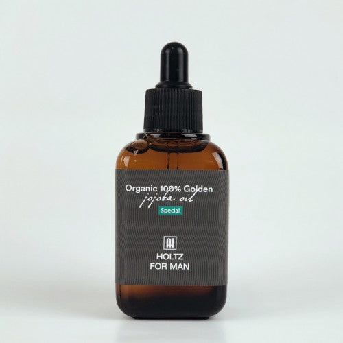 ANNA HOLTZ For Men 100% Golden Jojoba Oil 60ml : flacon brun avec gouttes, fond clair, huile capillaire