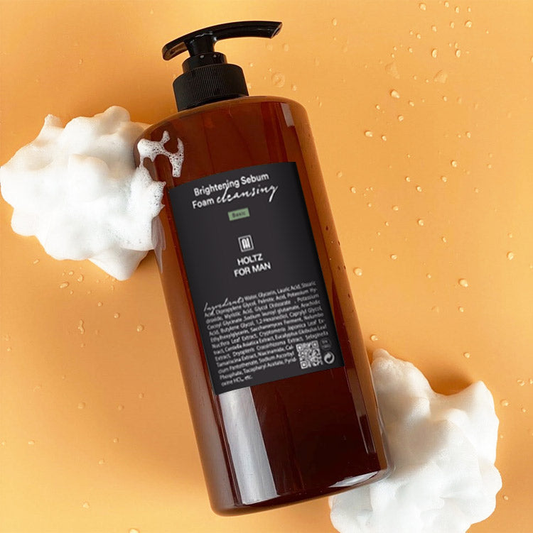 ANNA HOLTZ For Men Cleansing Foam 1000ml, mousse nettoyante en flacon noir sur fond orange, marque en évidence.
