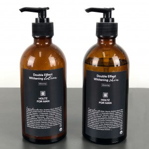 ANNA HOLTZ For Men Whitening Skin Lotion 300ml 2 Pieces : deux flacons bruns avec pompe, sur fond blanc, marque visible.