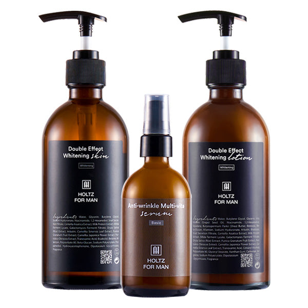 ANNA HOLTZ For Men Wrinkle-Improving Whitening Skin Lotion and Essence 3 Pieses Set, flacons bruns sur fond blanc.