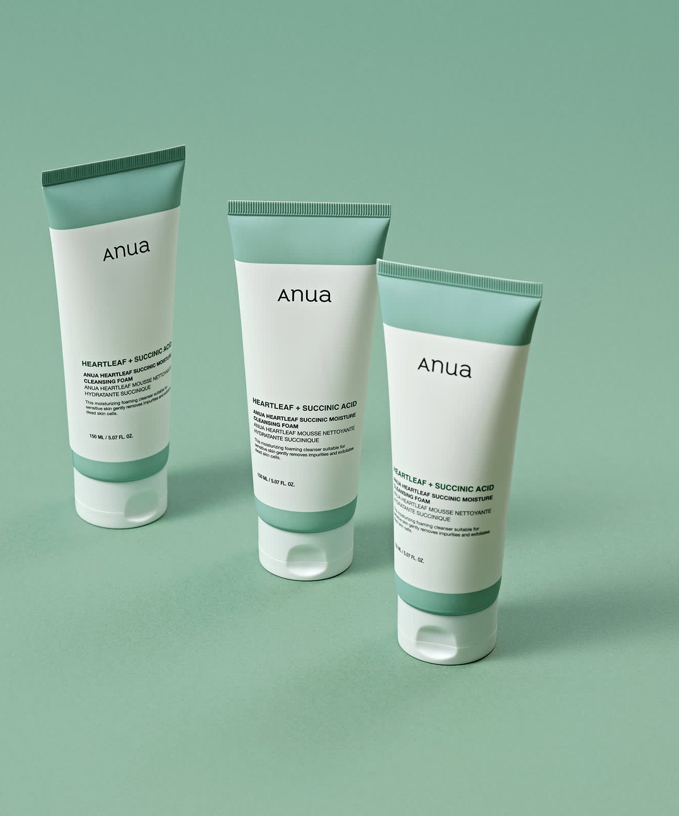 ANUA Heartleaf + Succinic Acid Moisture Cleansing Foam 150ml, tubes Anua sur fond vert, présentation produit.