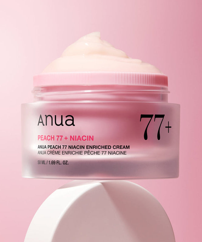 ANUA Peach 77 + Niacin Enriched Cream 50ml, pot crème sur fond rose pastel, marque ANUA, texture crème crémeuse.