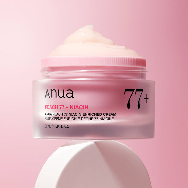 ANUA Peach 77 + Niacin Enriched Cream 50ml, pot crème sur fond rose pastel, marque ANUA, texture crème crémeuse.