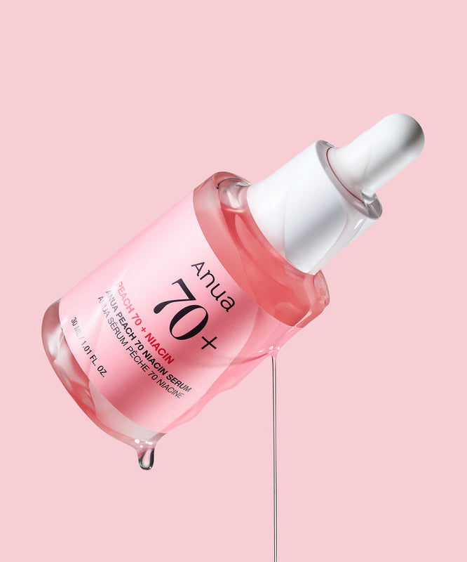 ANUA Peach 70 + Niacin Serum 30ml d’Anua, flacon sérum rouge sur fond rose, photo produit beauté.