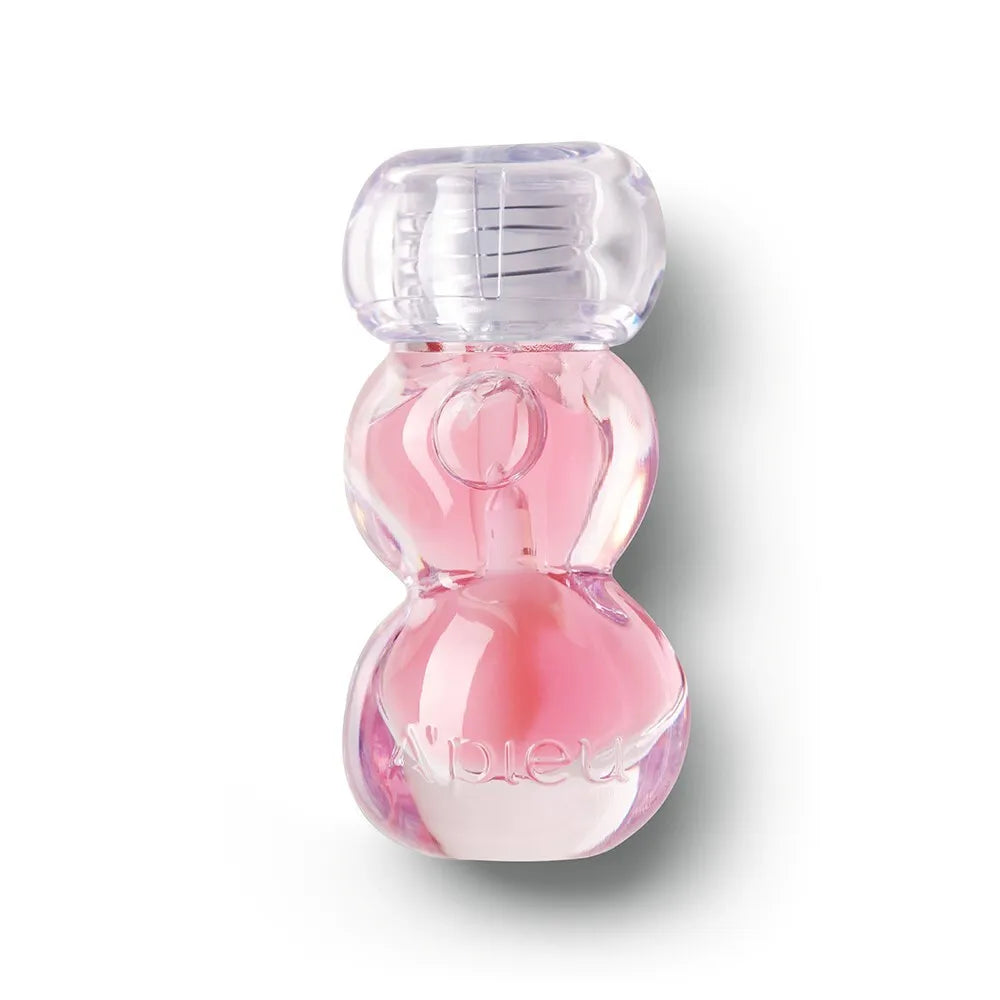 A'PIEU Jelly Honey Lip Oil 4g, baume lèvres miel en gel, flacon rose transparent sur fond blanc.