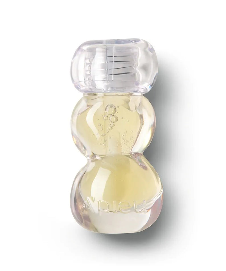 A'PIEU Jelly Honey Lip Oil 4g : flacon huileux translucide sur fond blanc, marque A'PIEU, contexte produit beauté