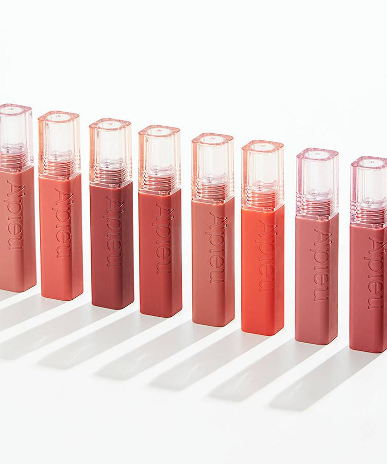 A'PIEU Juicy Pang Tint de la marque A'PIEU, lip tint en tubes roses et corail sur fond blanc, packshot produit.
