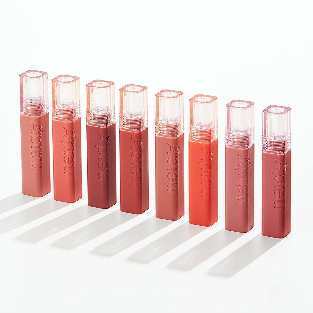 A'PIEU Juicy Pang Tint de la marque A'PIEU, lip tint en tubes roses et corail sur fond blanc, packshot produit.